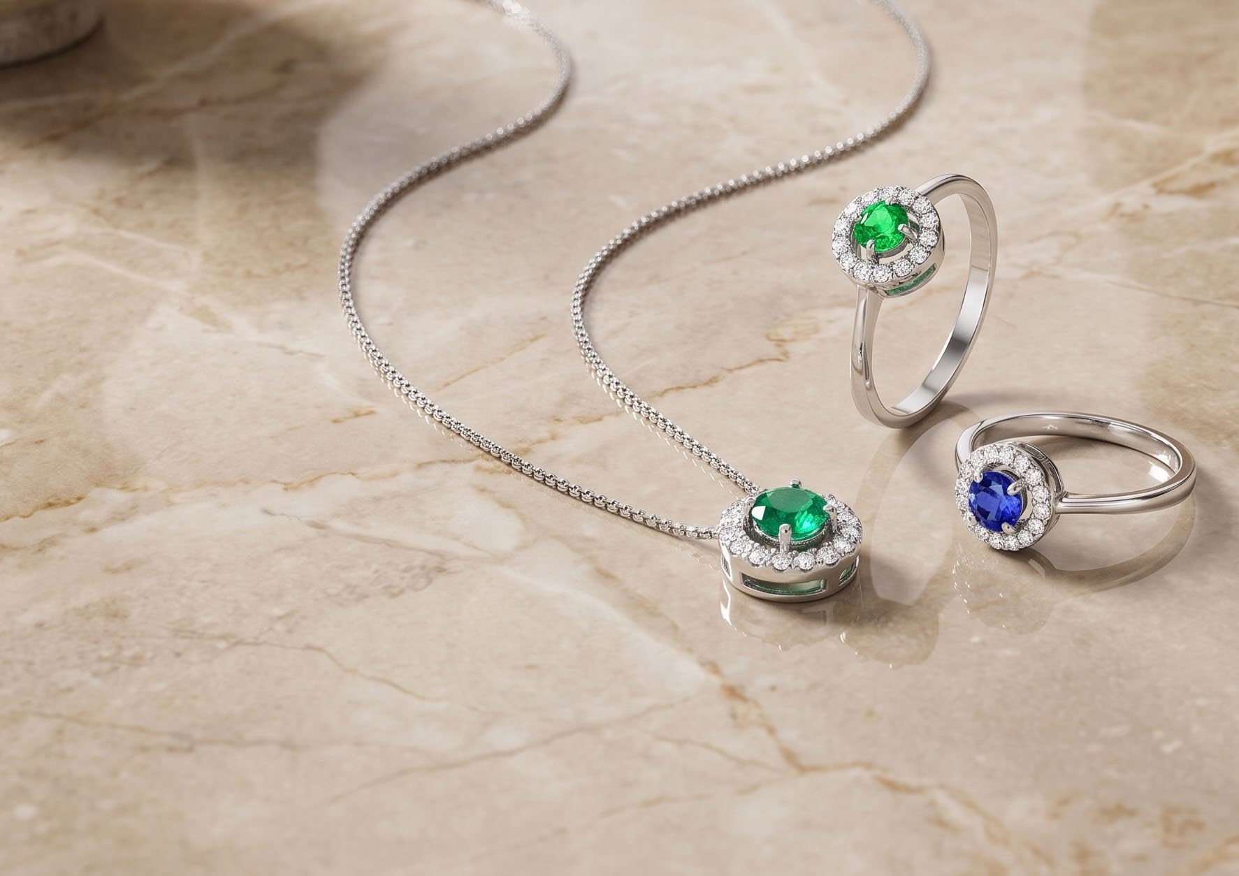 Collezione Pulsar di Conte Diamonds: anello, collana, pendente con diamante bianco, smeraldo, rubino